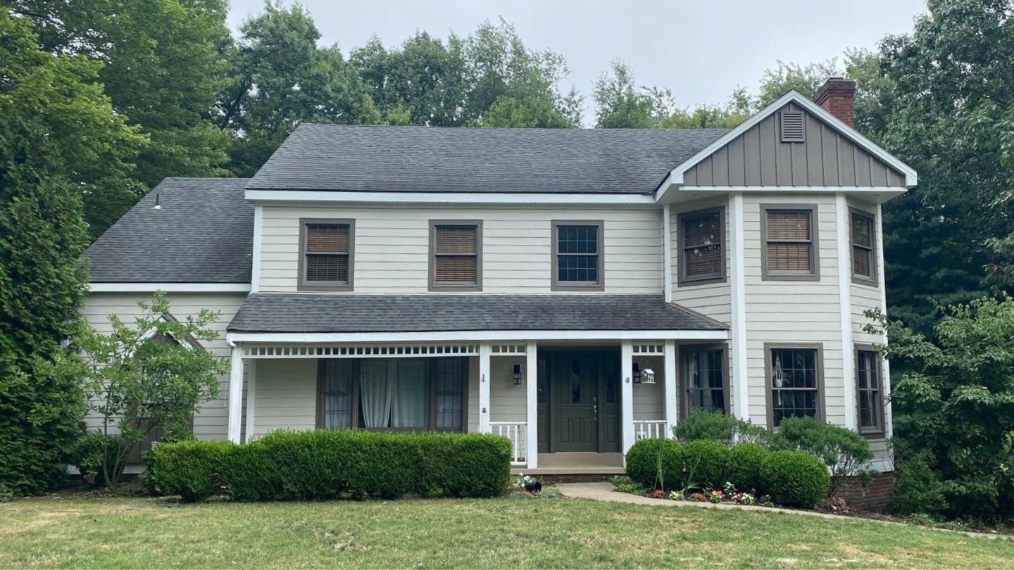 Beautifully painted vinyl siding on landscaped home exterior