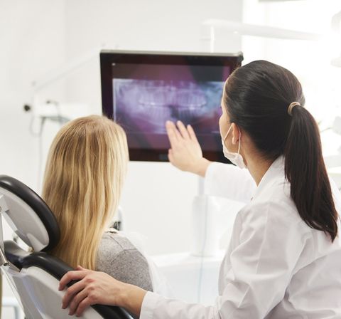 Dentist and Patient Looking at X-Ray Image — Fort Myers, FL — Children & Adult Dentistry