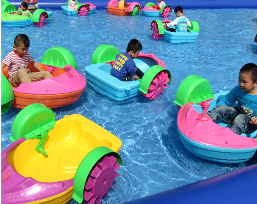 Kids hand paddle boat in the pool