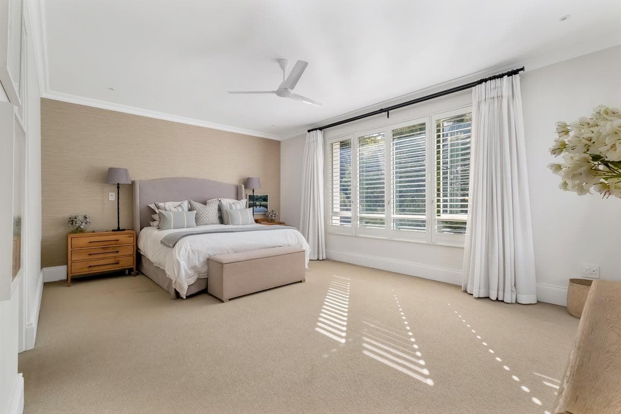 A large dining room with a long table and chairs