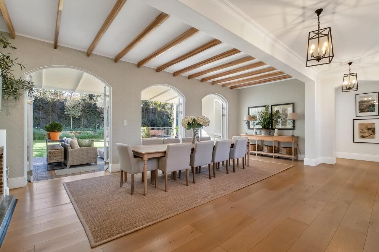 A living room with a couch , coffee table , and television.