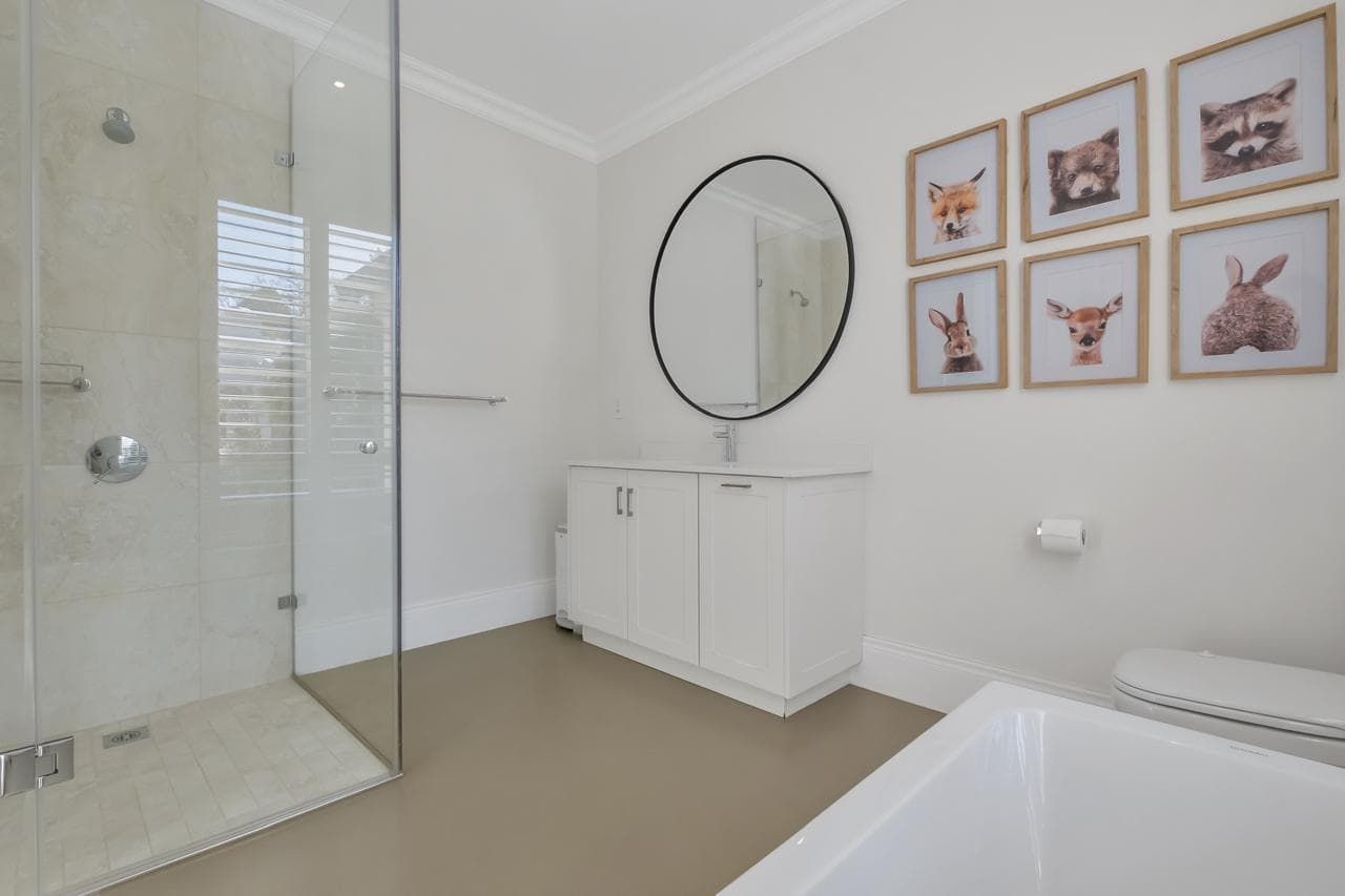 A kitchen with a table and chairs and a fireplace.