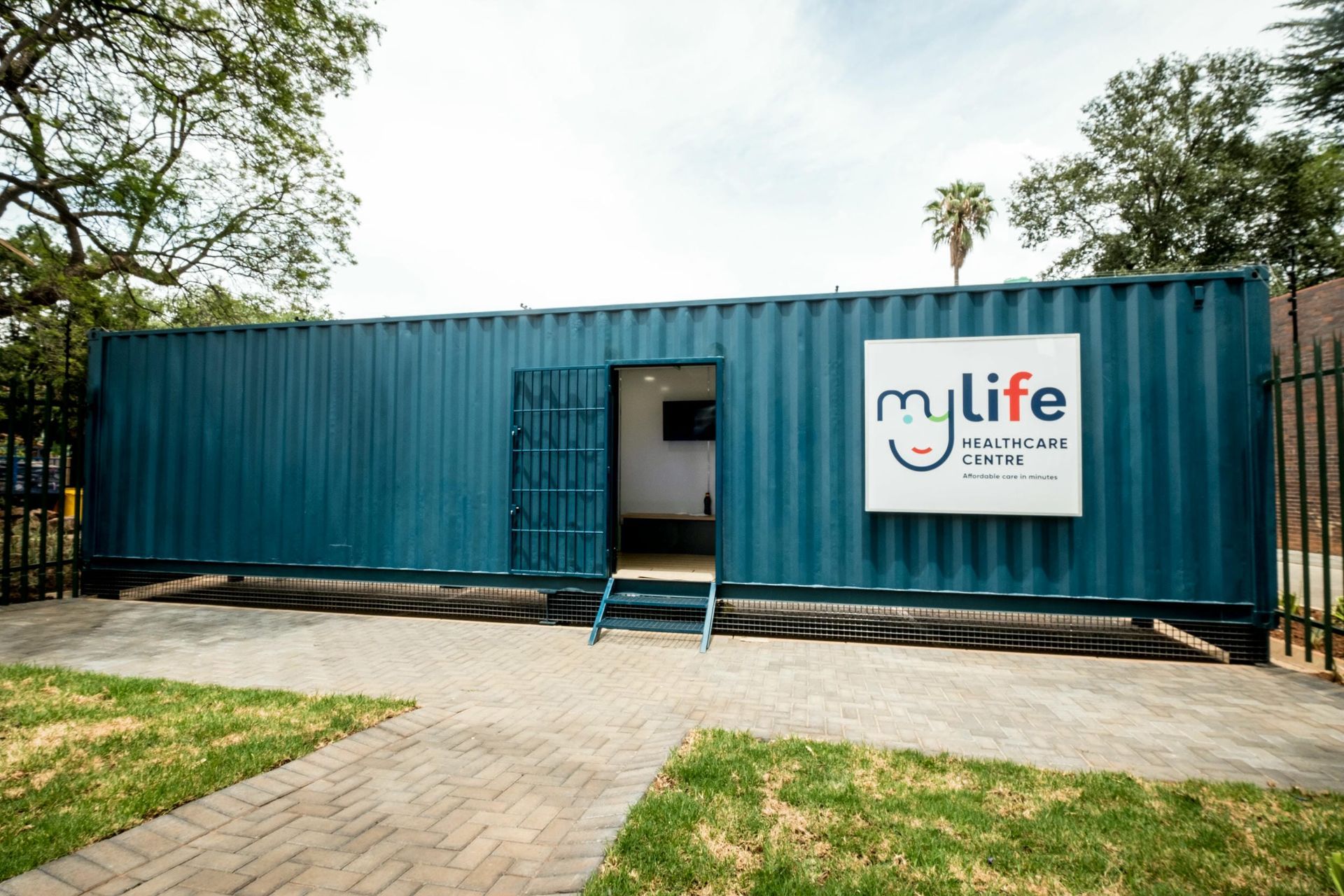 A blue shipping container with a sign on it that says `` mylife ''.
