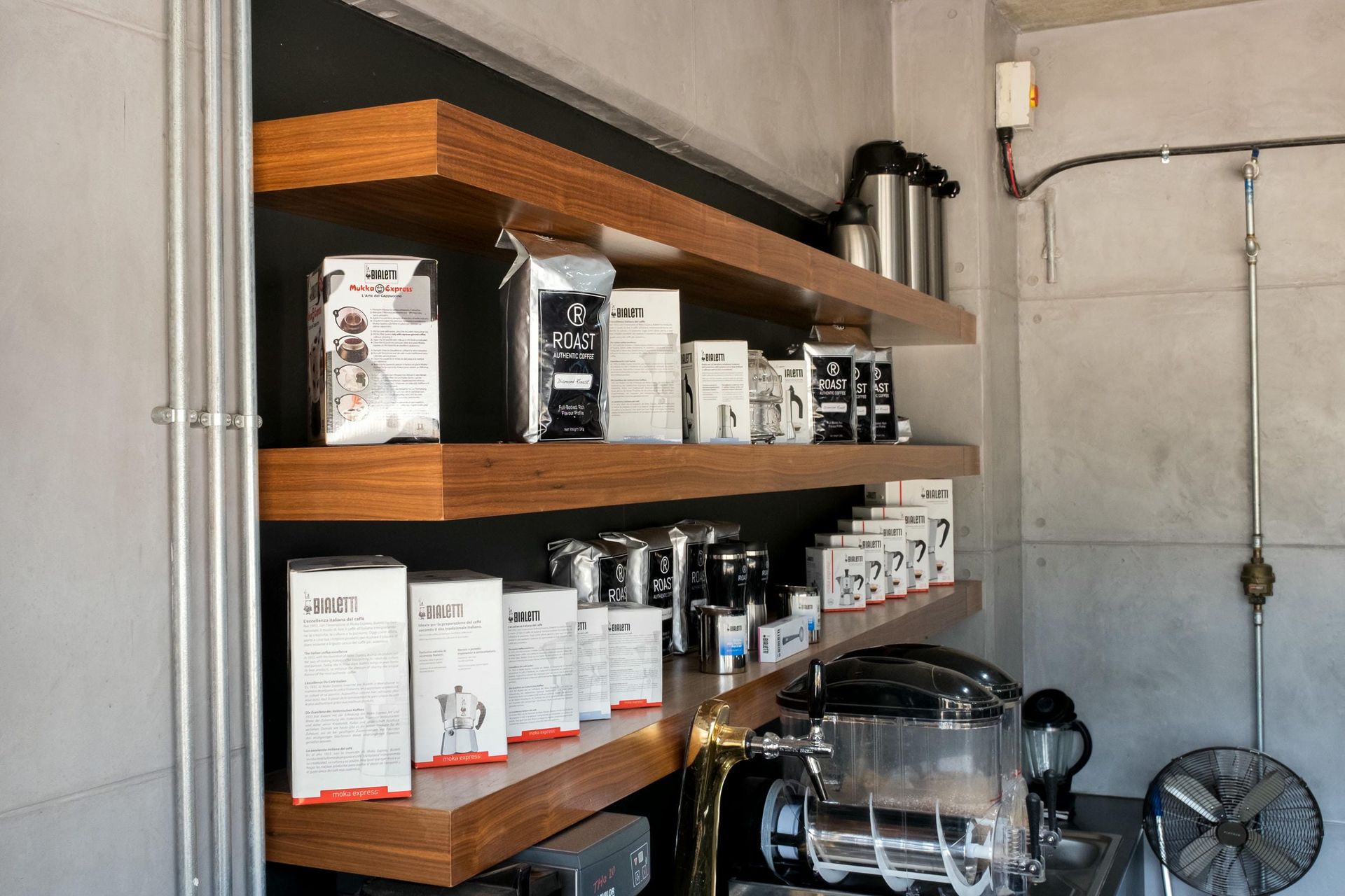 A room with a lot of shelves and boxes on them.