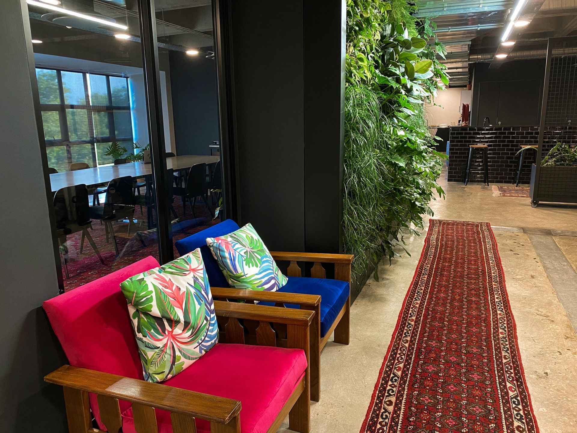 A couple of chairs sitting next to each other in a room.