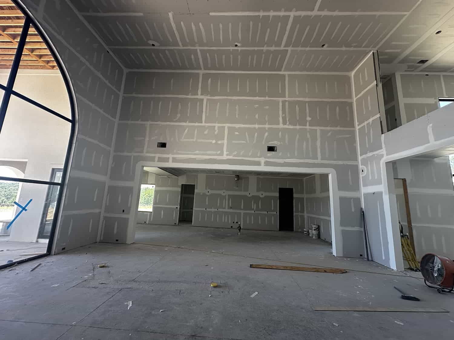 A large room with a lot of drywall on the walls