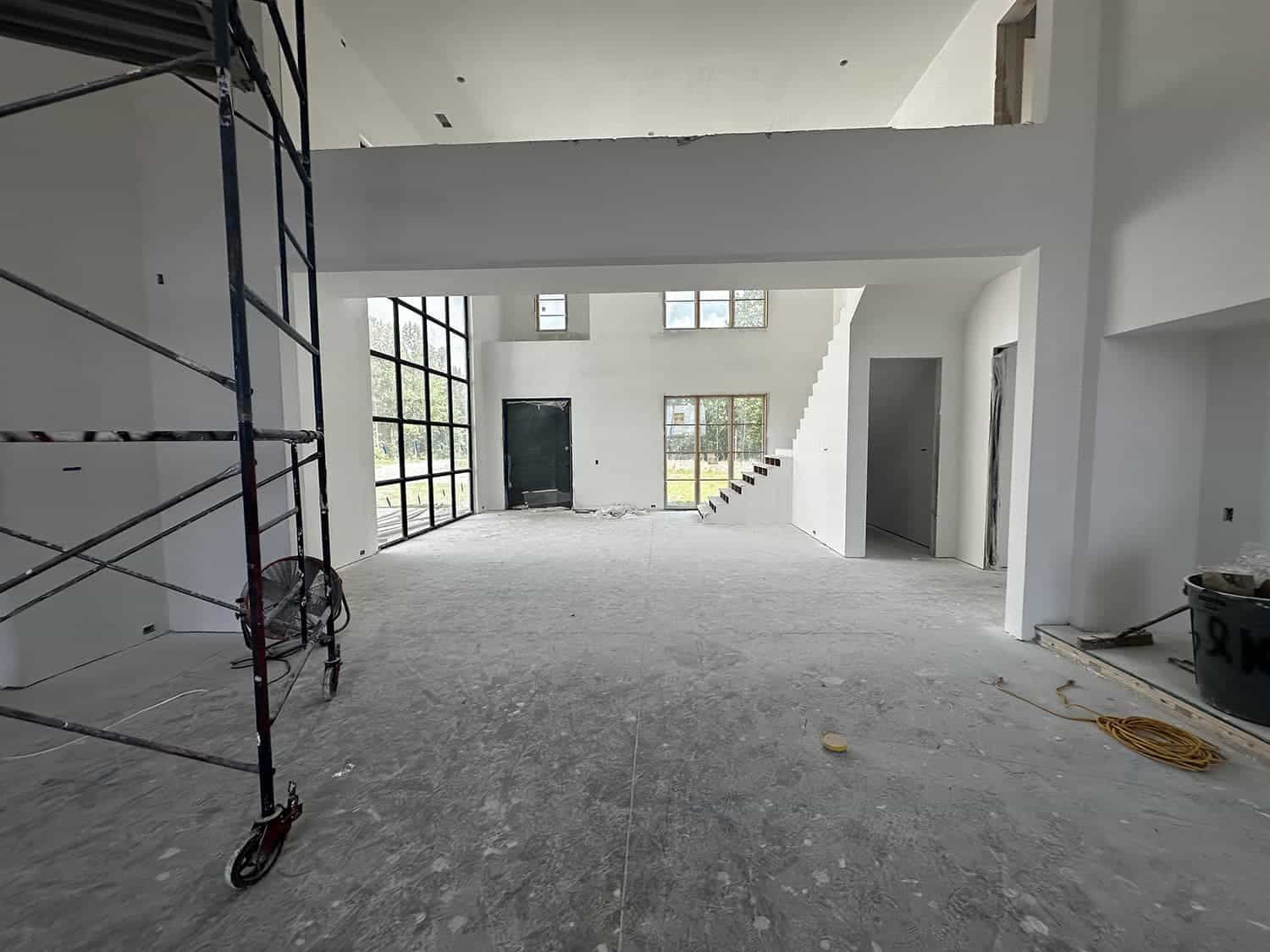 A large empty room with a scaffolding in the middle of it.