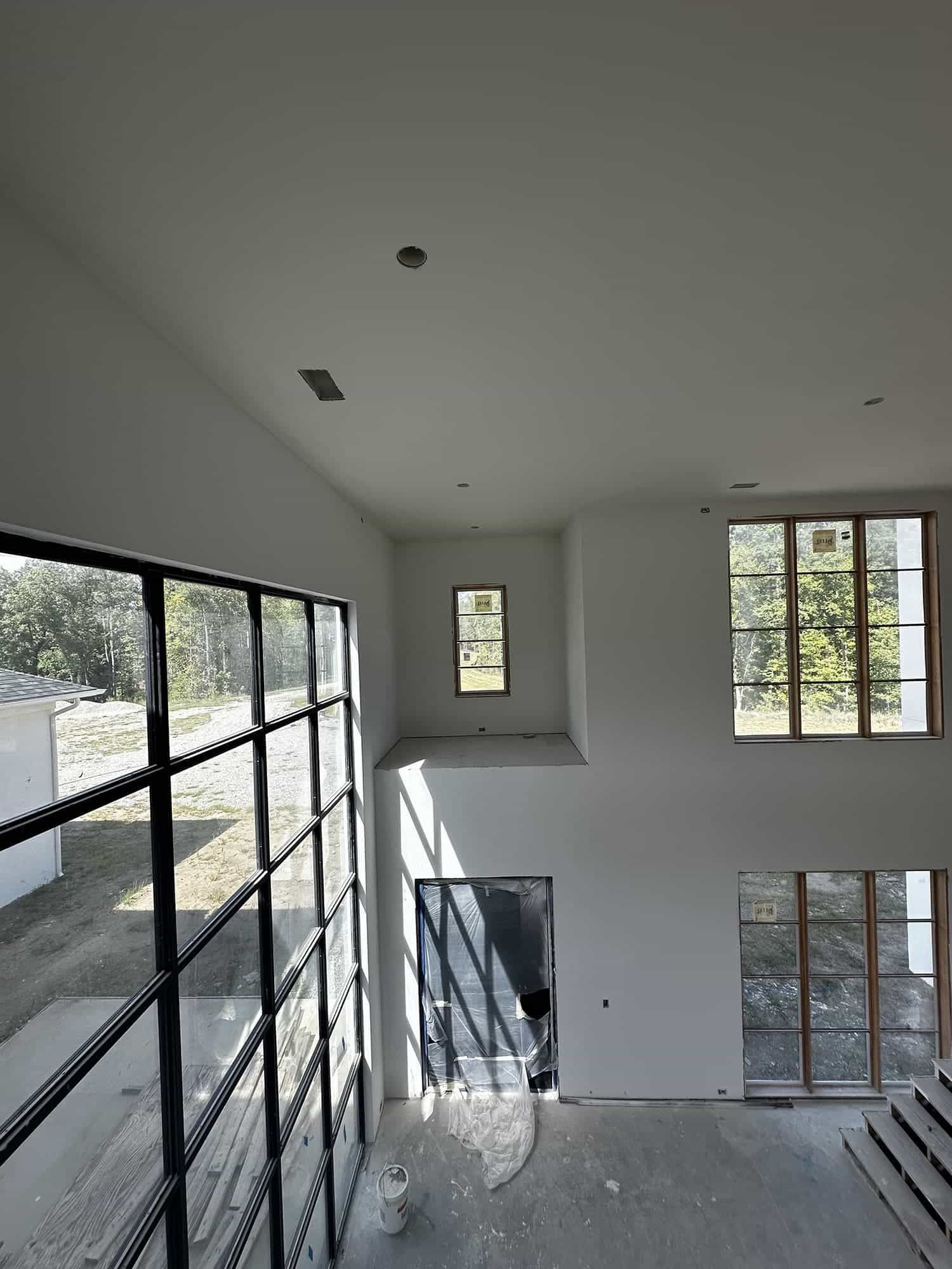 A large room with a lot of windows and stairs