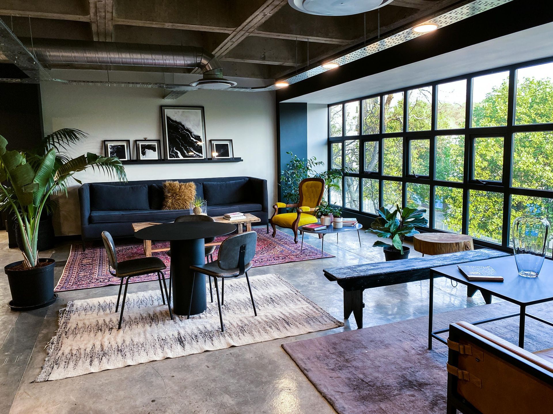 A living room filled with furniture and lots of windows.