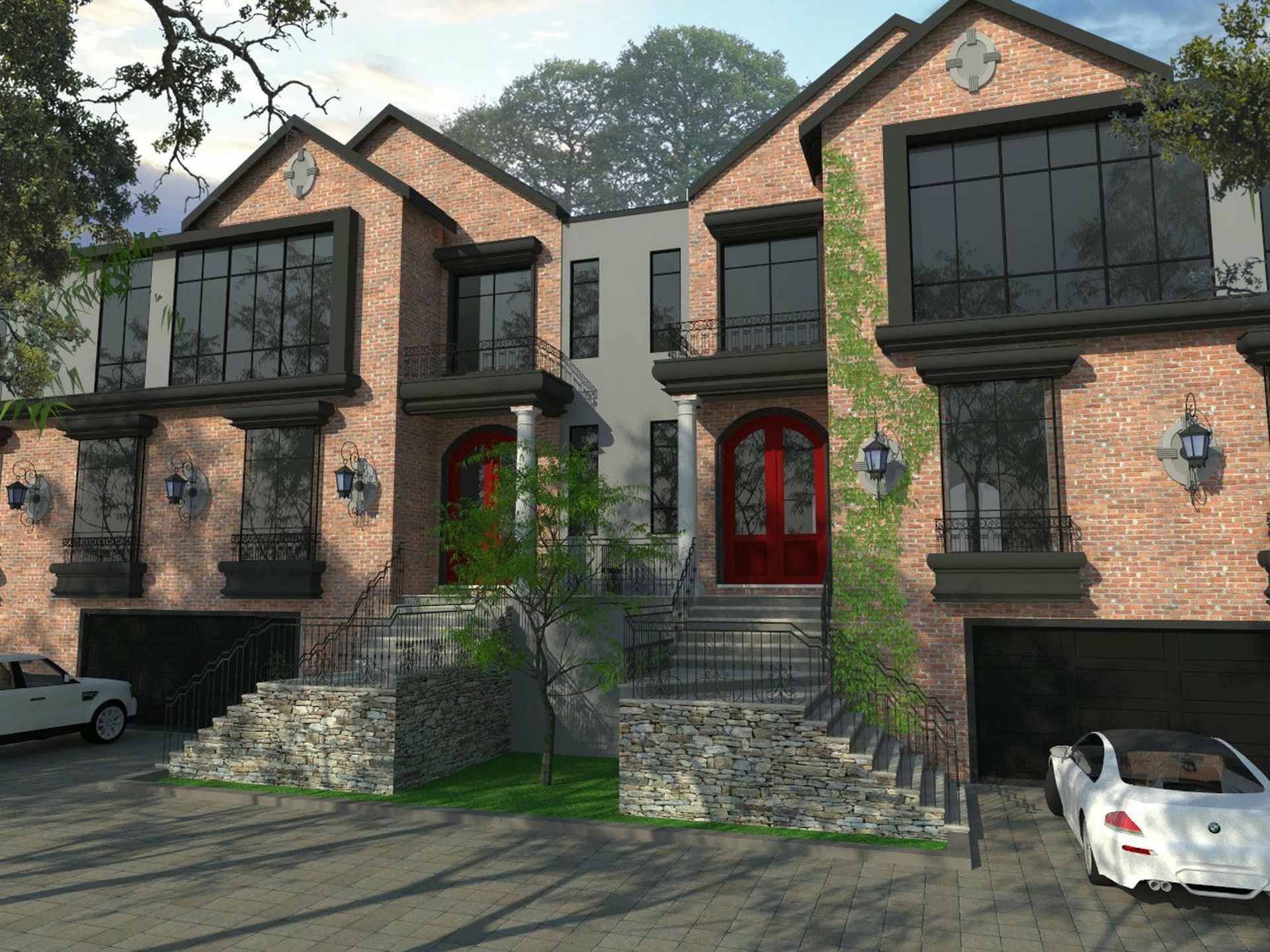 A white car is parked in front of a brick building.