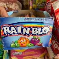 A box of Rain Blo candy featuring colorful cartoon fruits and rainbow stripes.