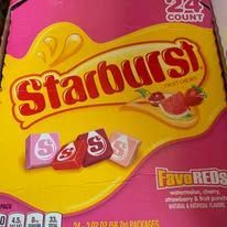 Box of Starburst FaveREDS candies featuring a pink and yellow design with the Starburst logo and candy pieces.
