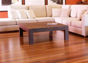 laminate flooring in living room with matching coffee table