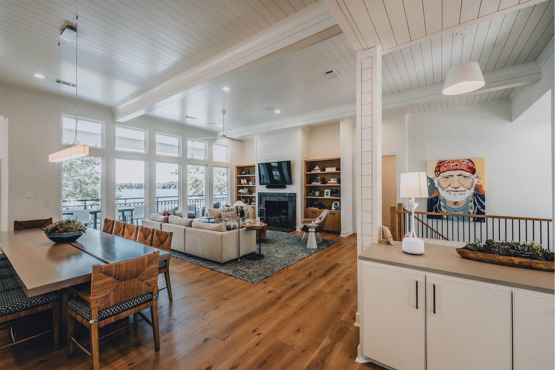 A living room and dining room in a house with hardwood floors.
