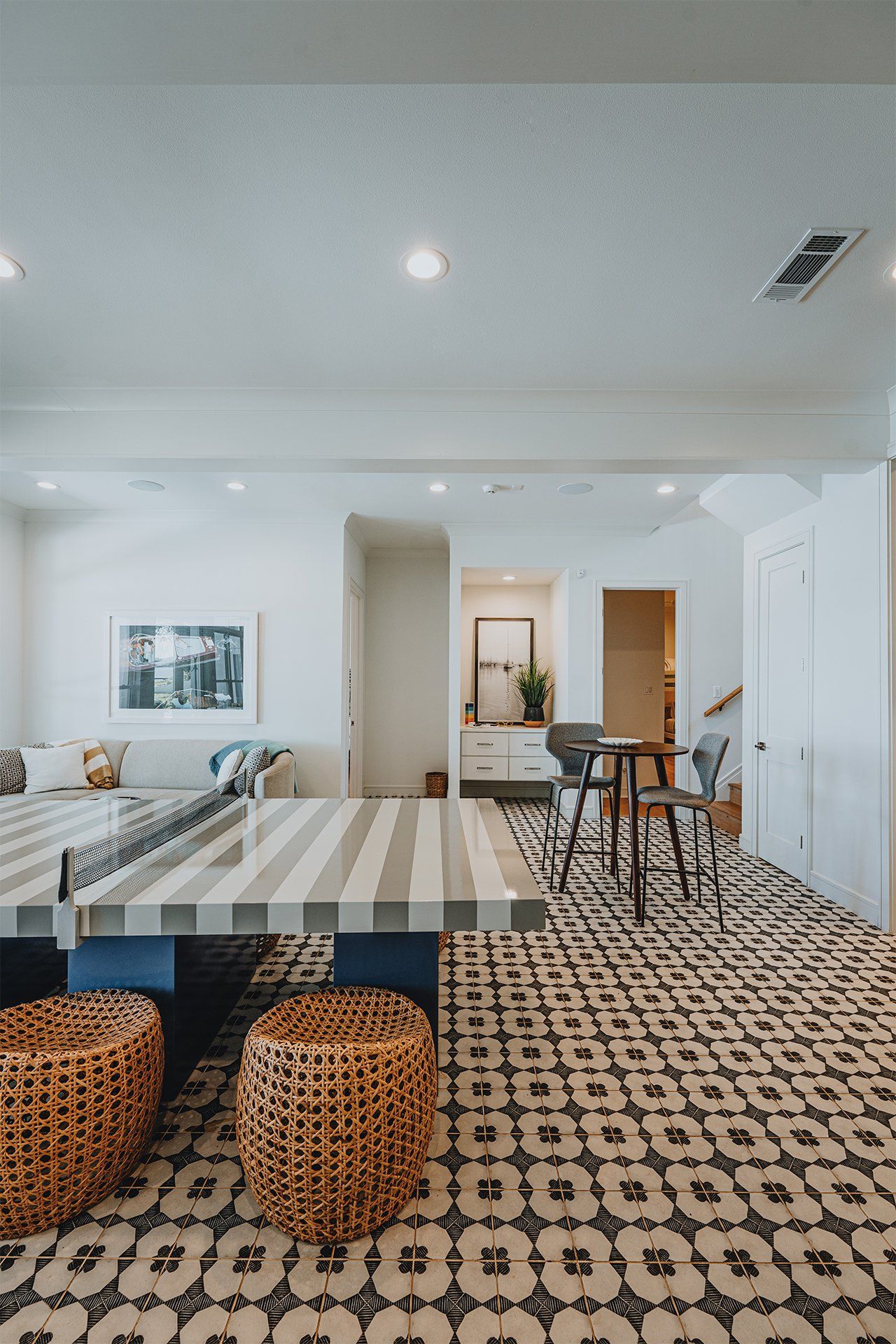 There is a ping pong table in the middle of the room.