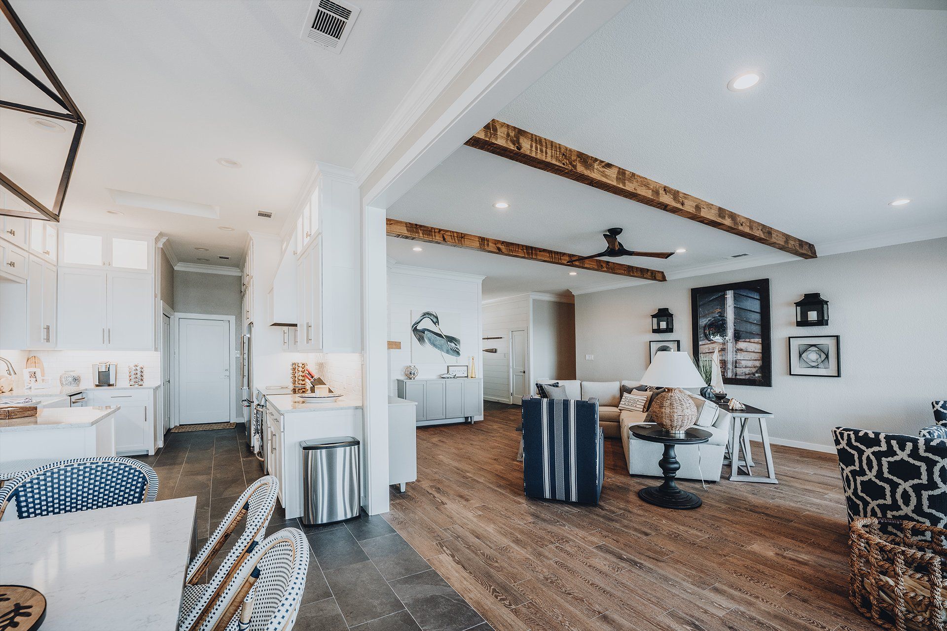 A living room filled with furniture and a ceiling fan.