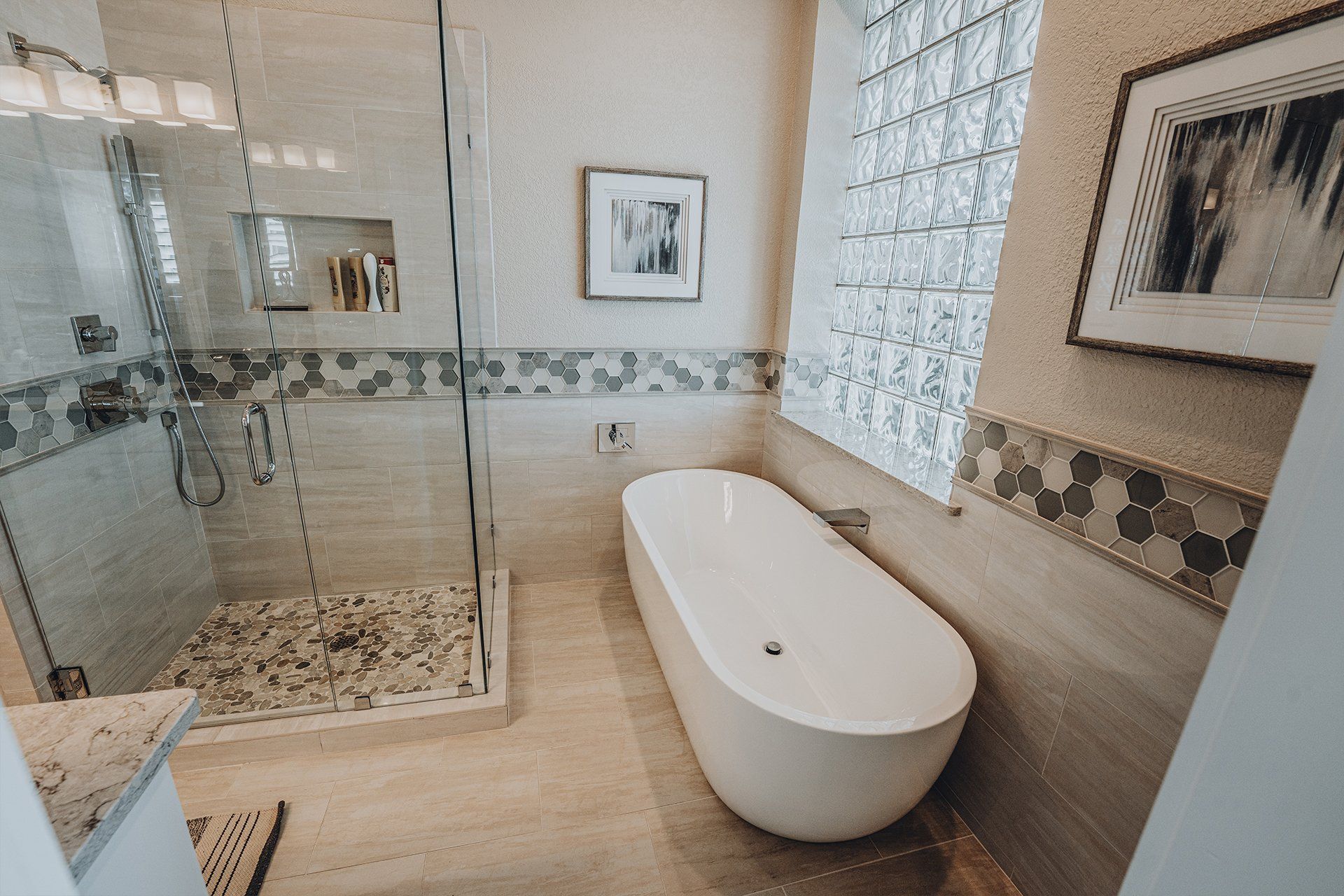 A bathroom with a bathtub and a walk in shower.