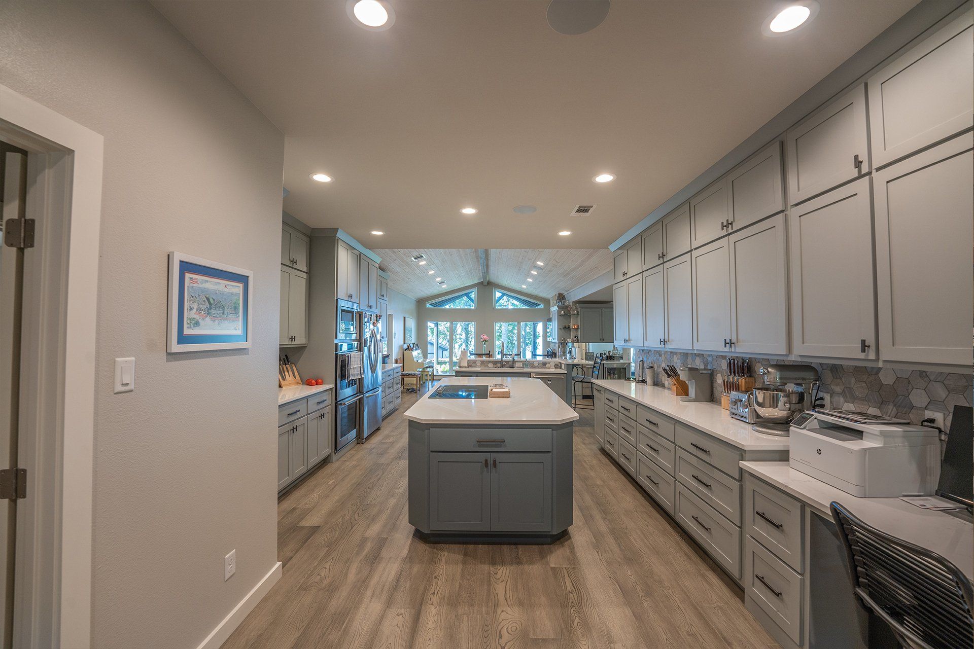There is a large island in the middle of the kitchen.