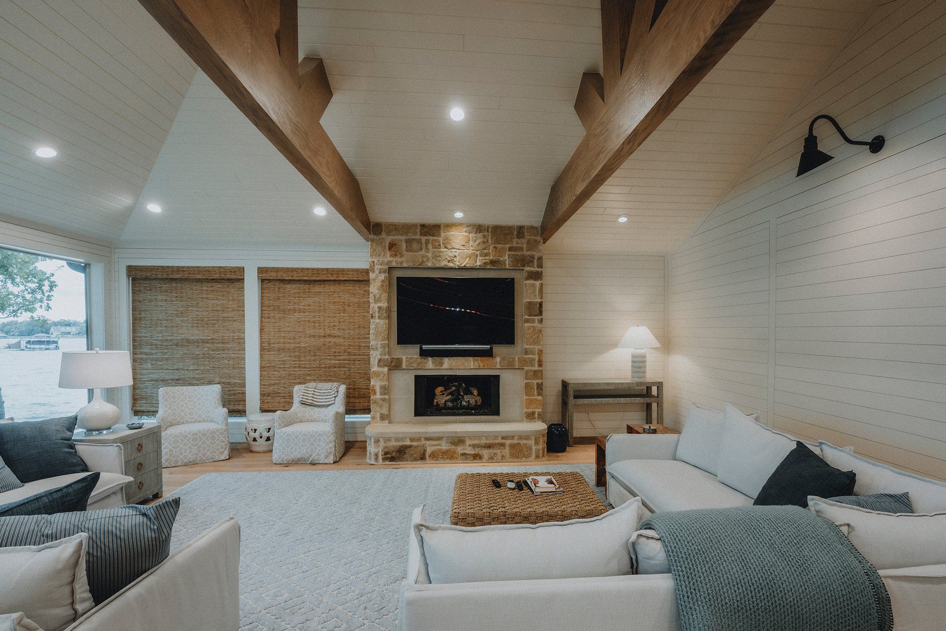 A living room filled with furniture and a fireplace.