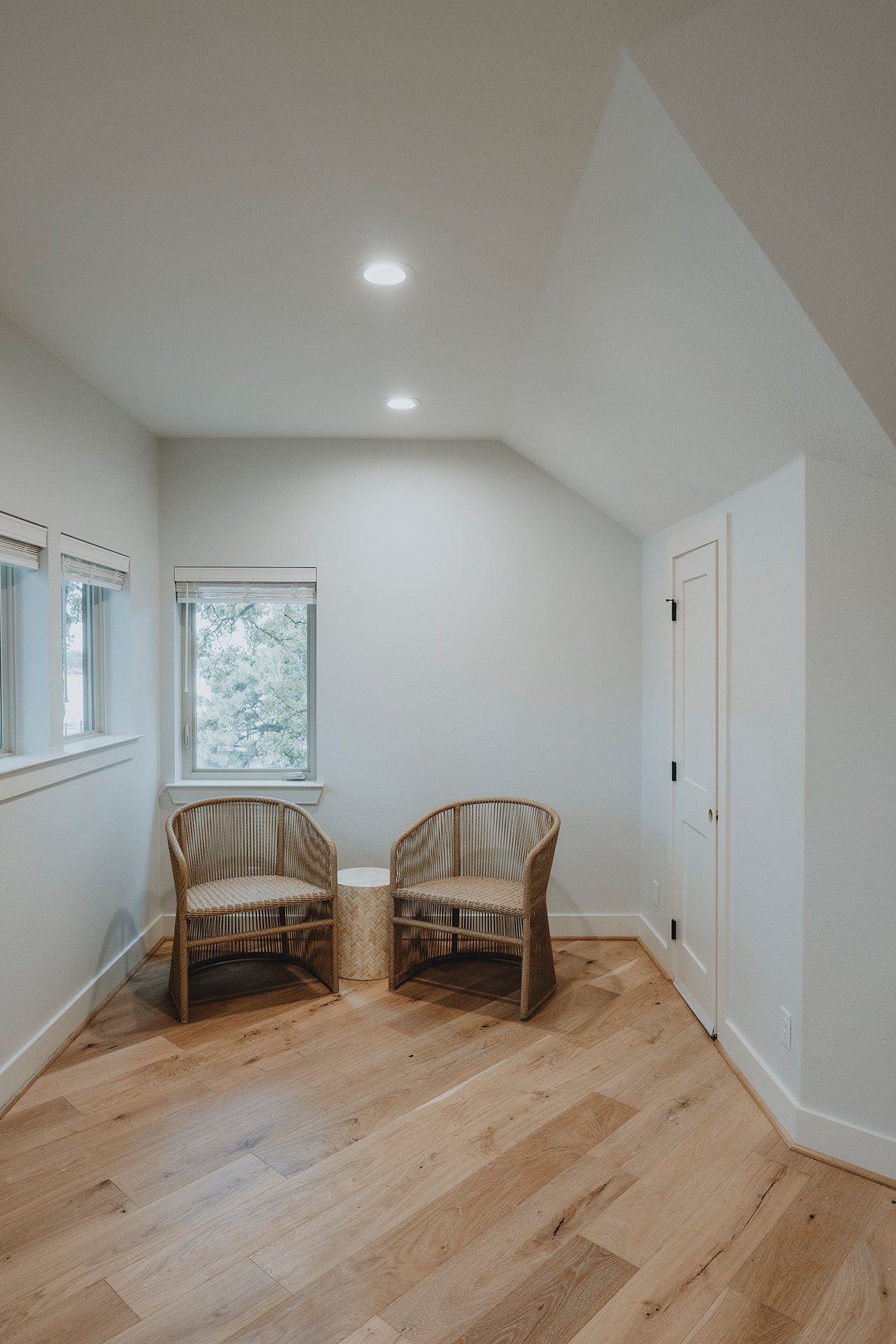Two chairs are sitting in a room with hardwood floors.