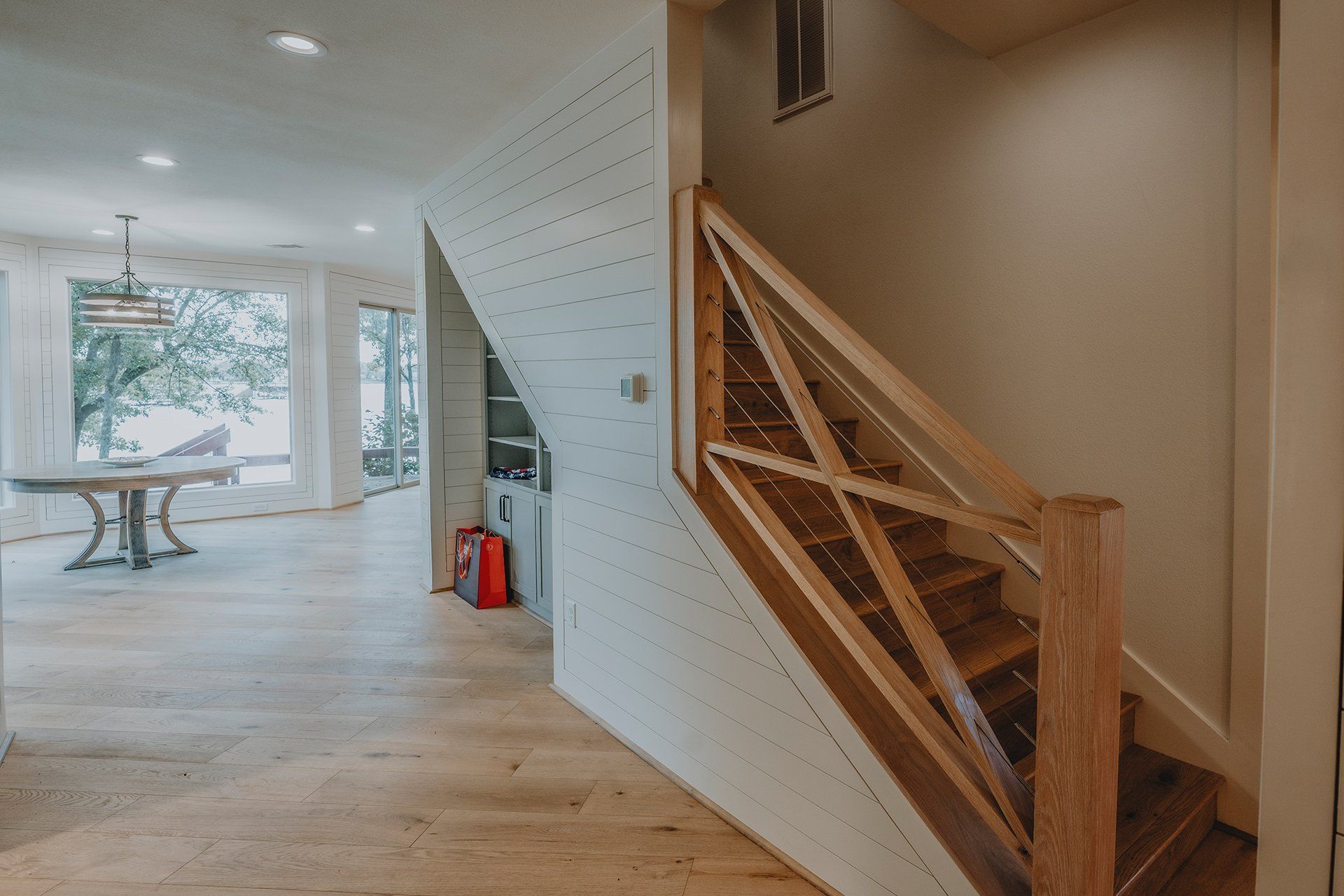 A wooden staircase leading up to the second floor of a house.