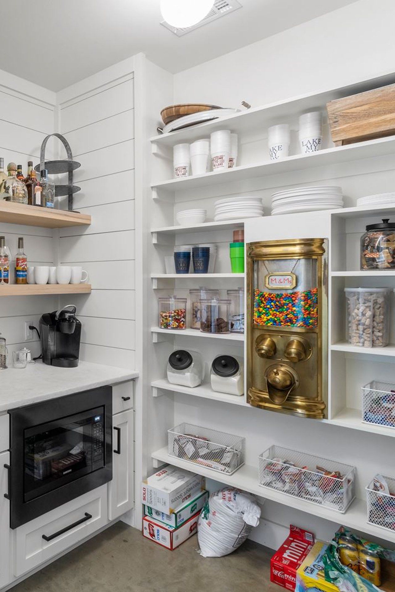 There is a gumball machine in the pantry.