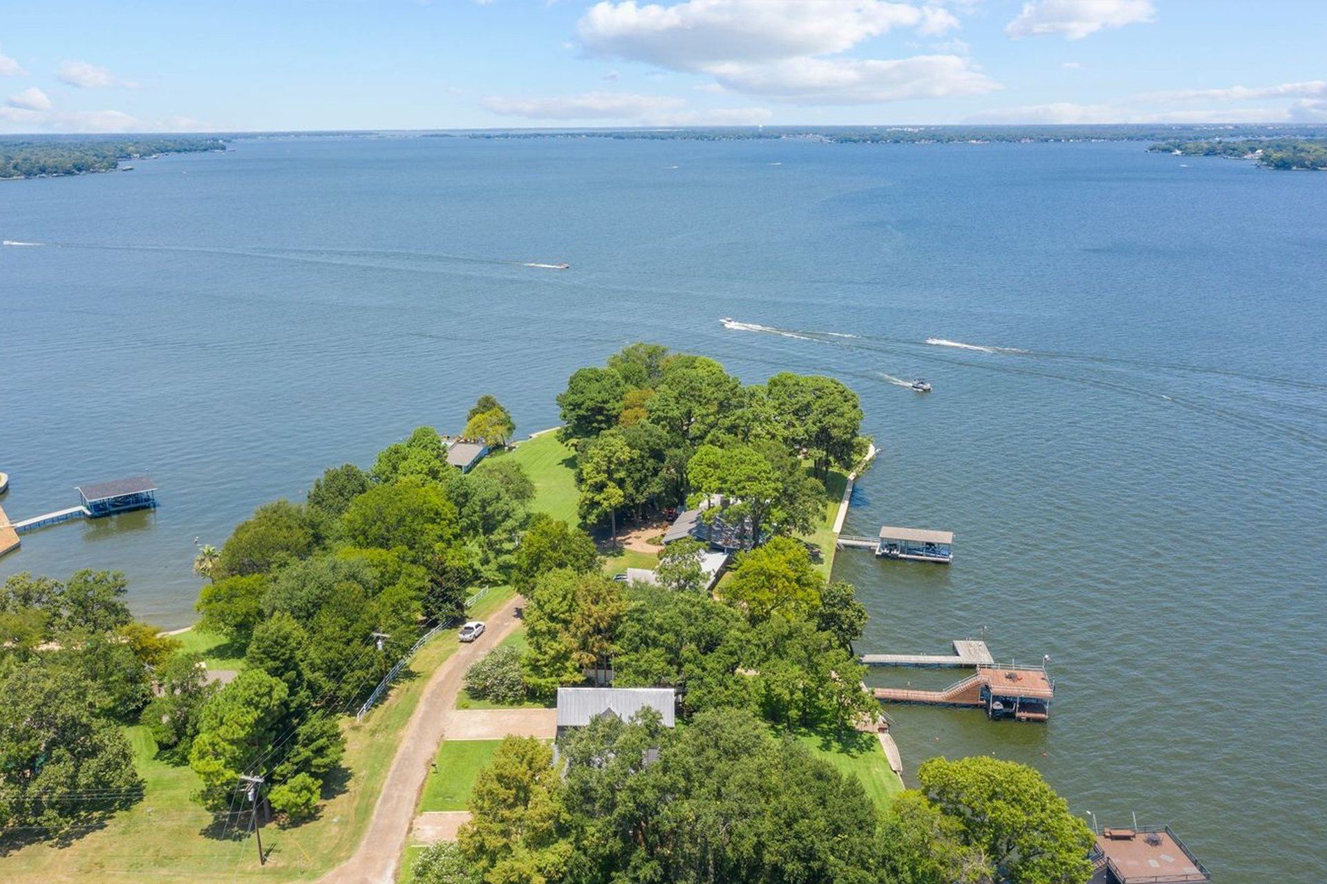 An aerial view of a small island in the middle of a large body of water.