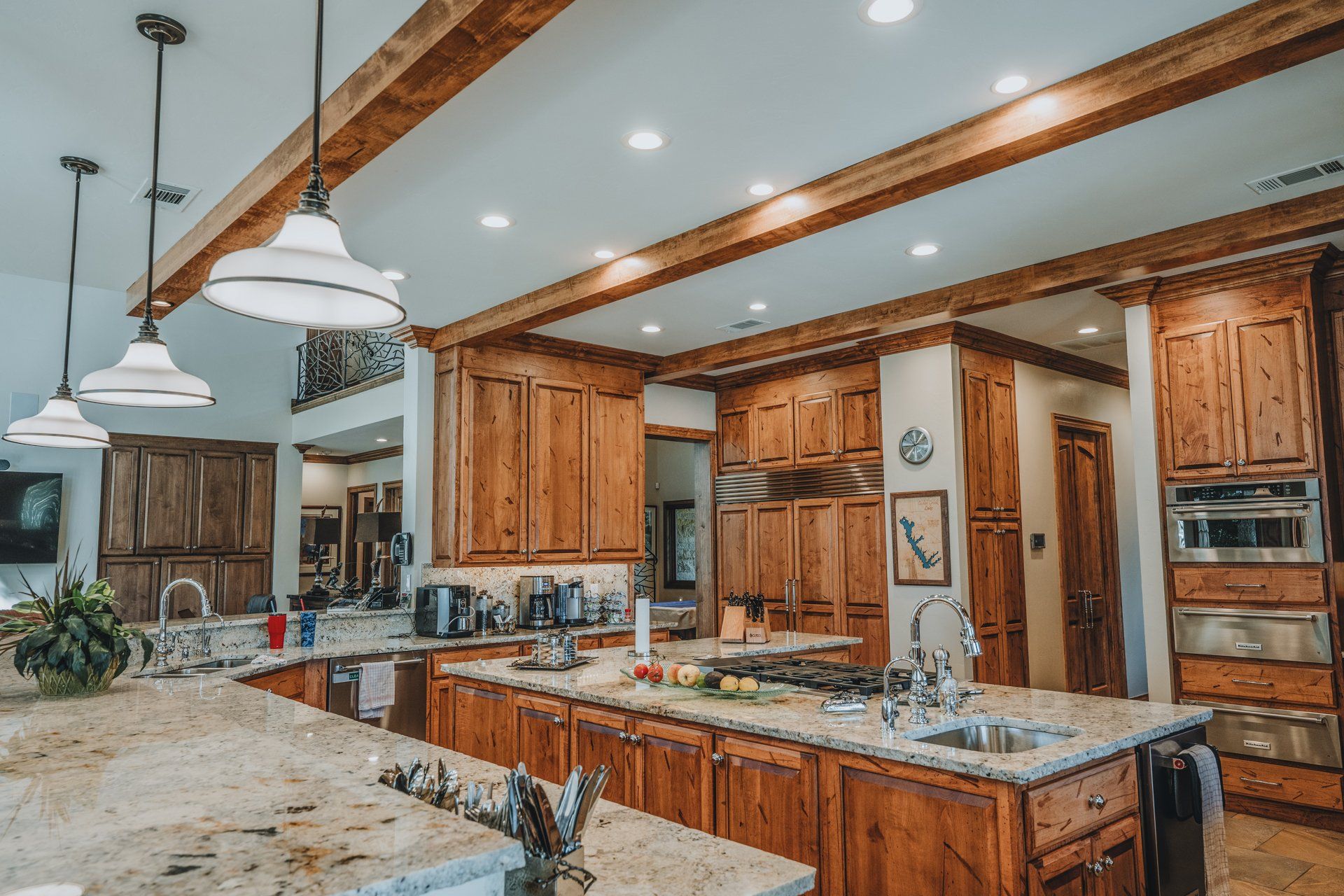 A large kitchen with wooden cabinets and granite counter tops.