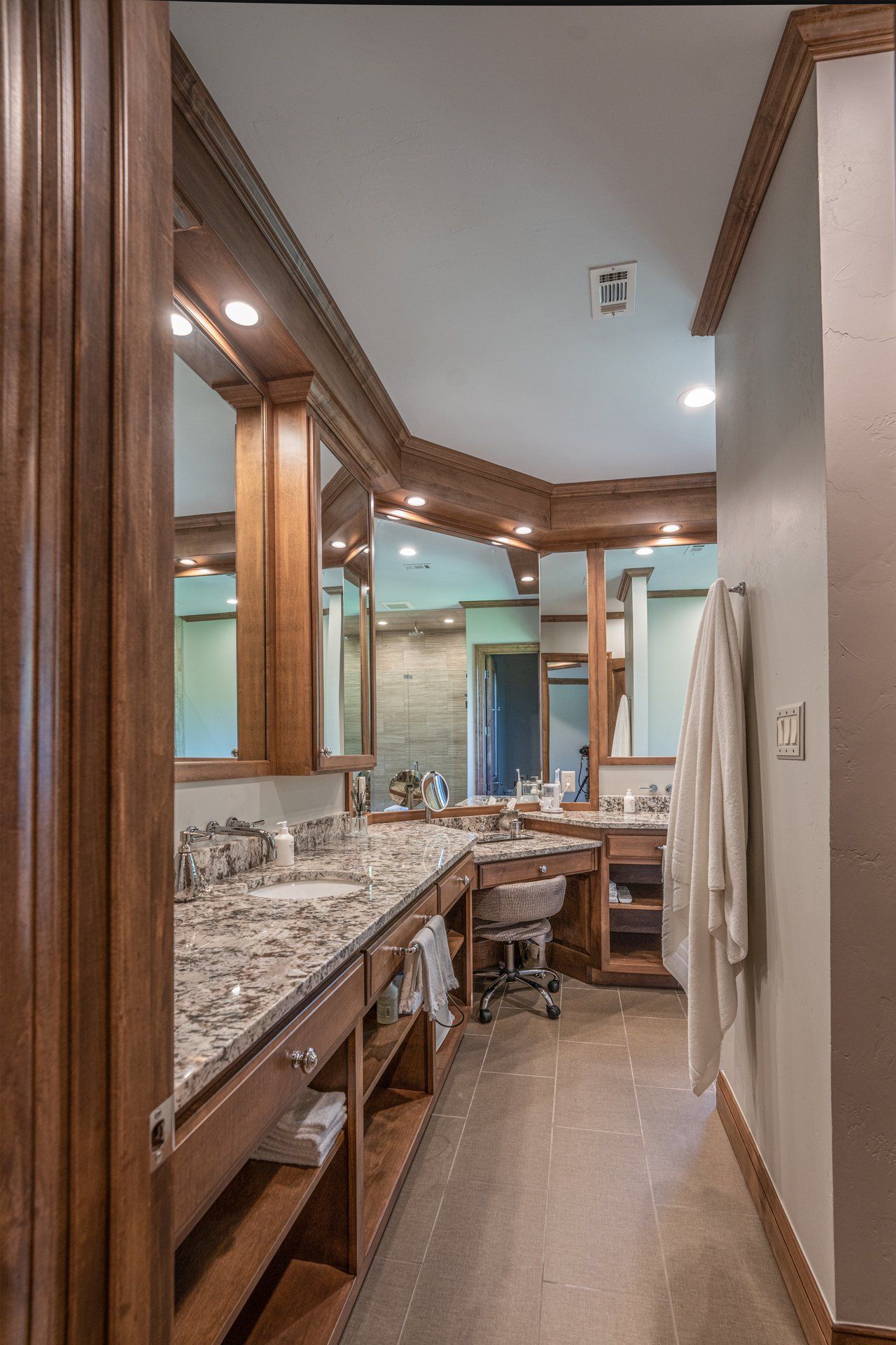 A bathroom with two sinks and two mirrors.