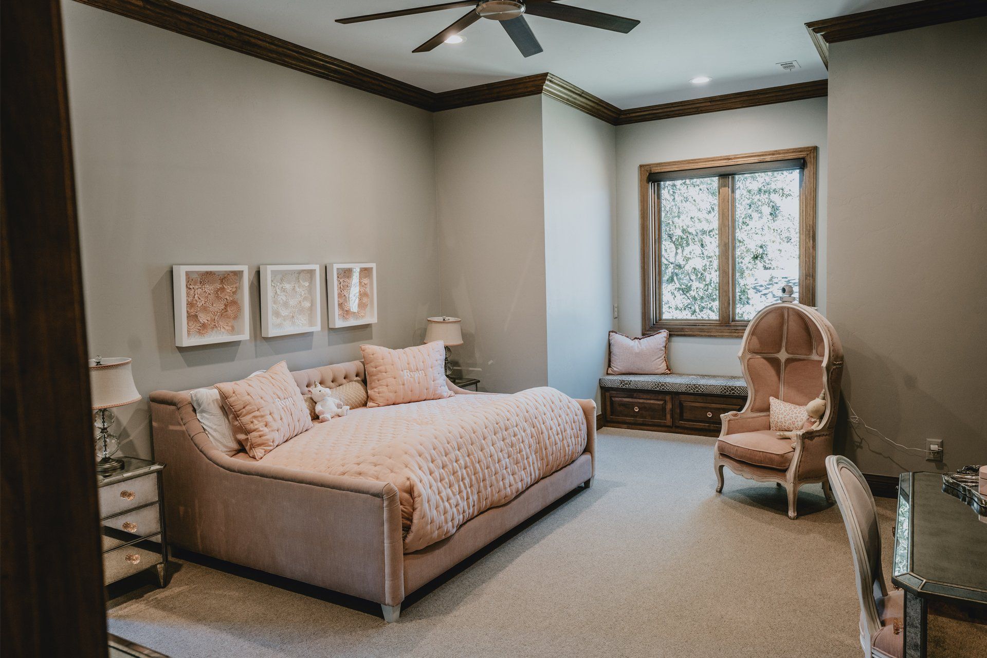 A bedroom with a bed , chair , desk and window.