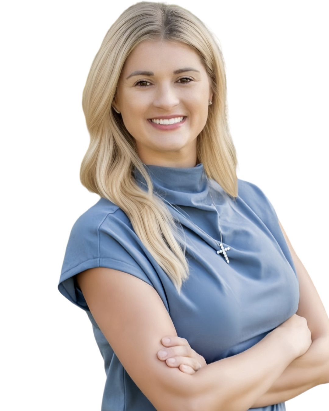 Chasity Verret Martinez smiling, arms crossed, wearing a blue top.