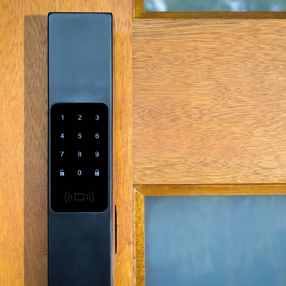 A Close Up of a Keypad on a Wooden Door — SPL Security Solutions In Southport, NSW