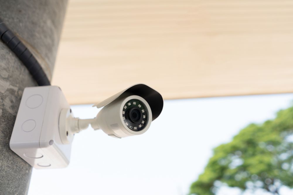 A Security Camera Is Mounted To A Concrete Wall — SPL Security Solutions In Mermaid, QLD