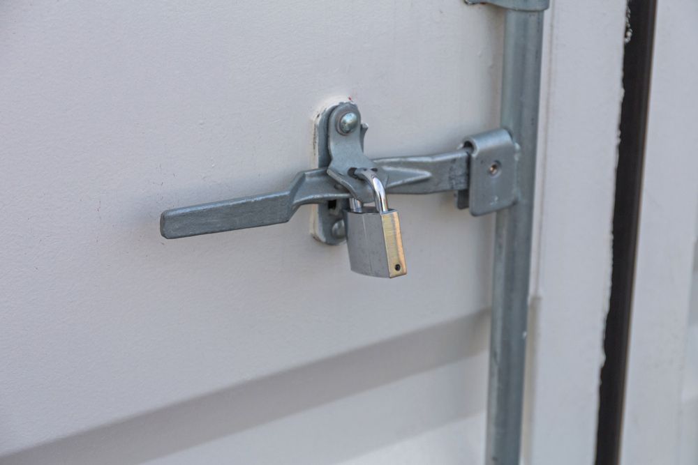 A Close Up Of A Door With A Padlock On It — SPL Security Solutions In Elanora, QLD