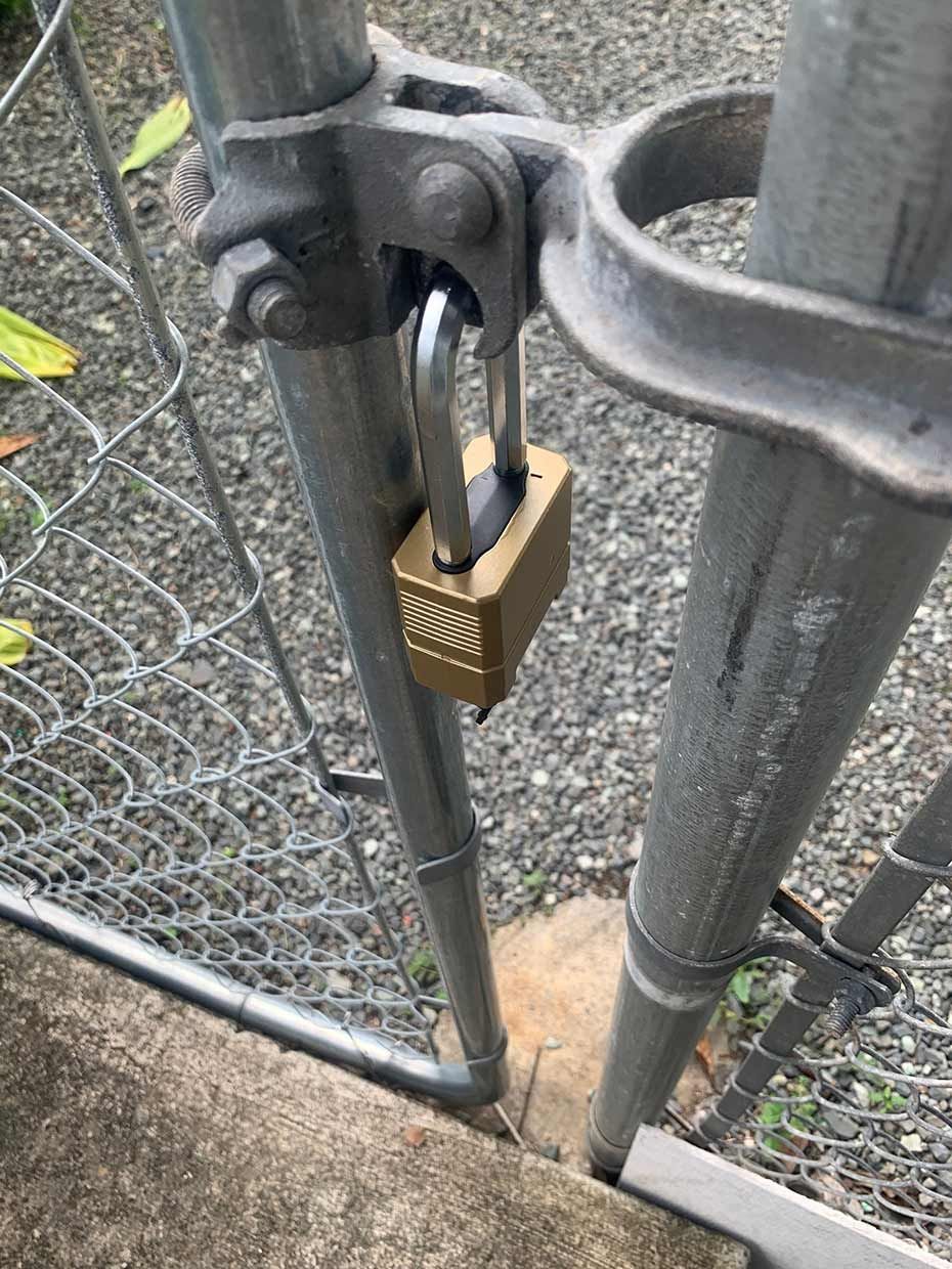 A Close Up of a Padlock on a Chain Link Fence — SPL Security Solutions In Hope Island, QLD