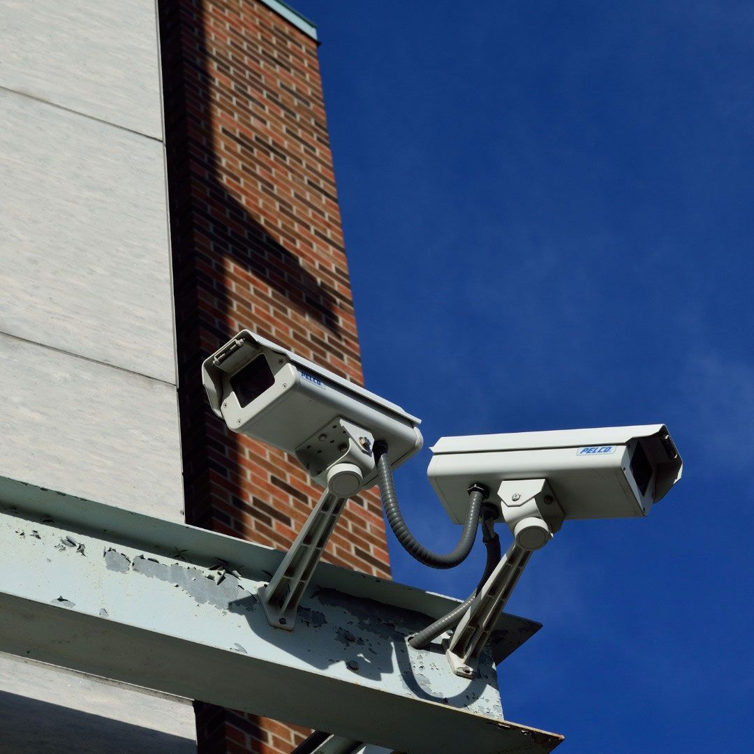Two Security Cameras on the Side of a Building — SPL Security Solutions In Currumbin, QLD