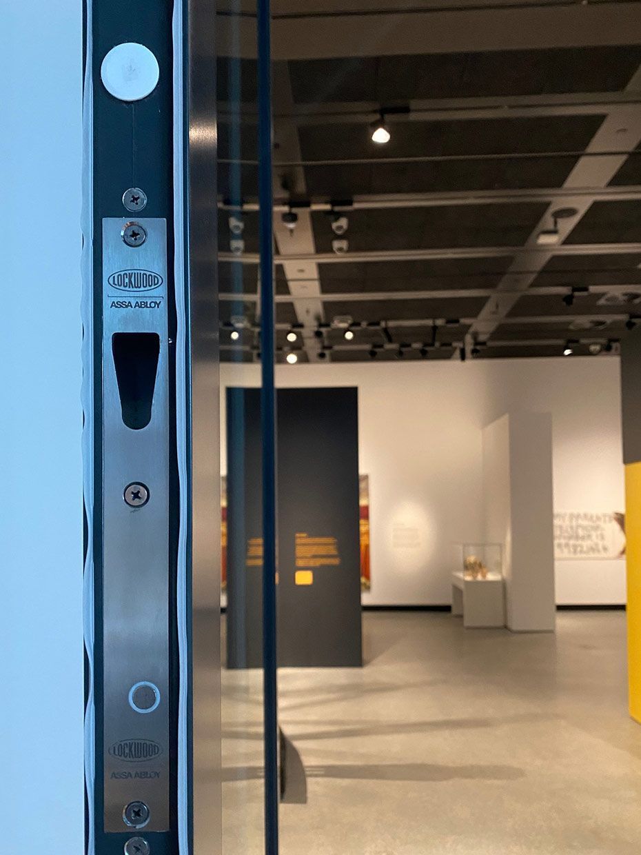 A Door With a Stainless Steel Latch is Open to a Museum — SPL Security Solutions In Elanora, QLD