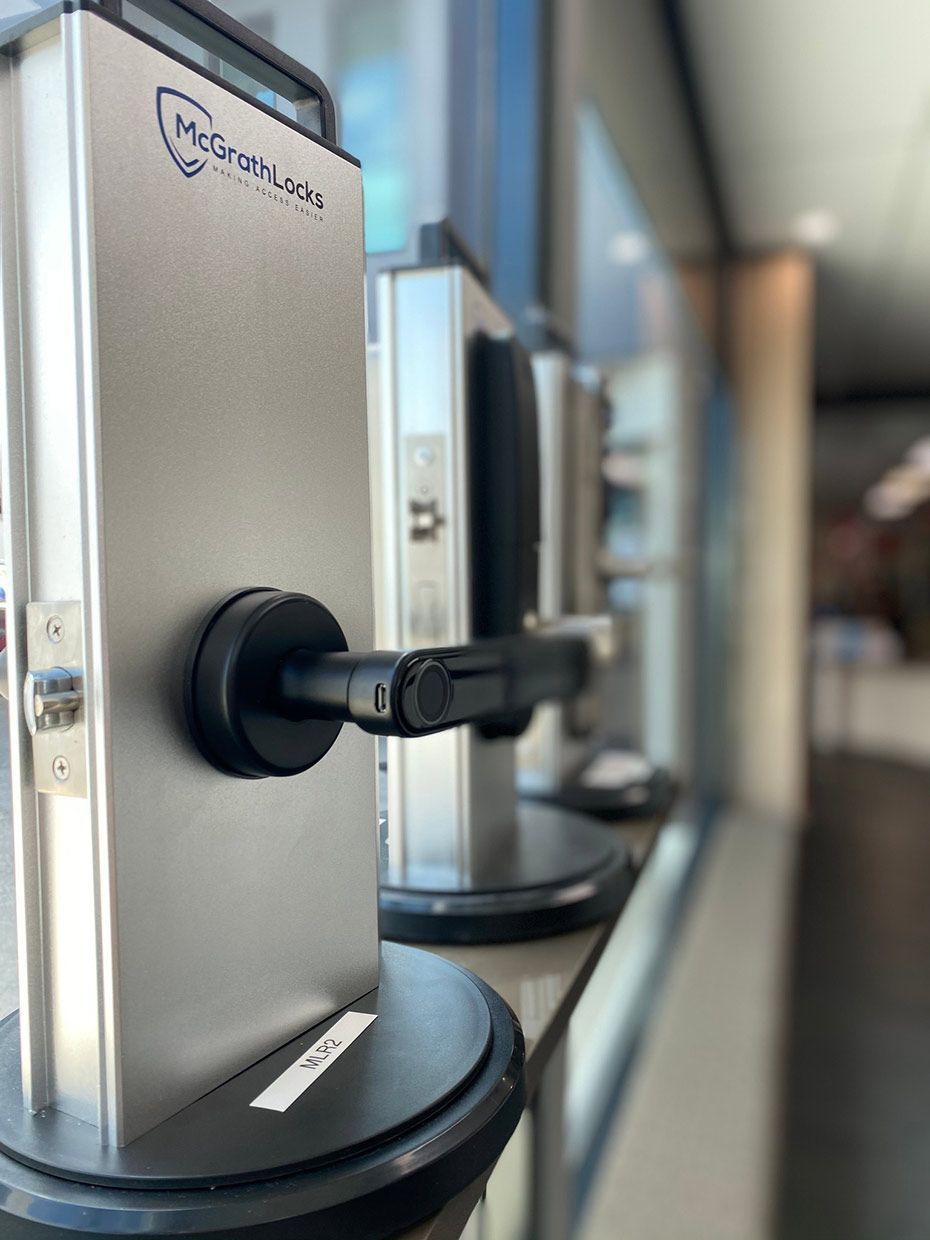 A Row of Stainless Steel Door Locks on Display in a Store — SPL Security Solutions In Varsity Lakes, QLD