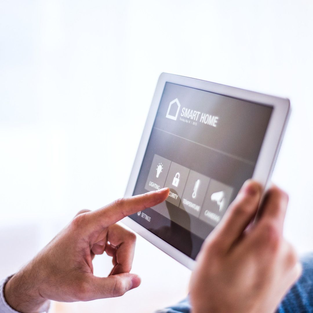 A Person is Using a Tablet With a Smart Home App on It — SPL Security Solutions In Broadbeach Waters, QLD