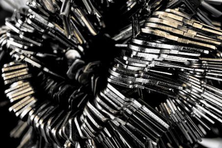 A Bunch Of Keys Are Stacked On Top Of Each Other On A Table — SPL Security Solutions In Molendinar, QLD