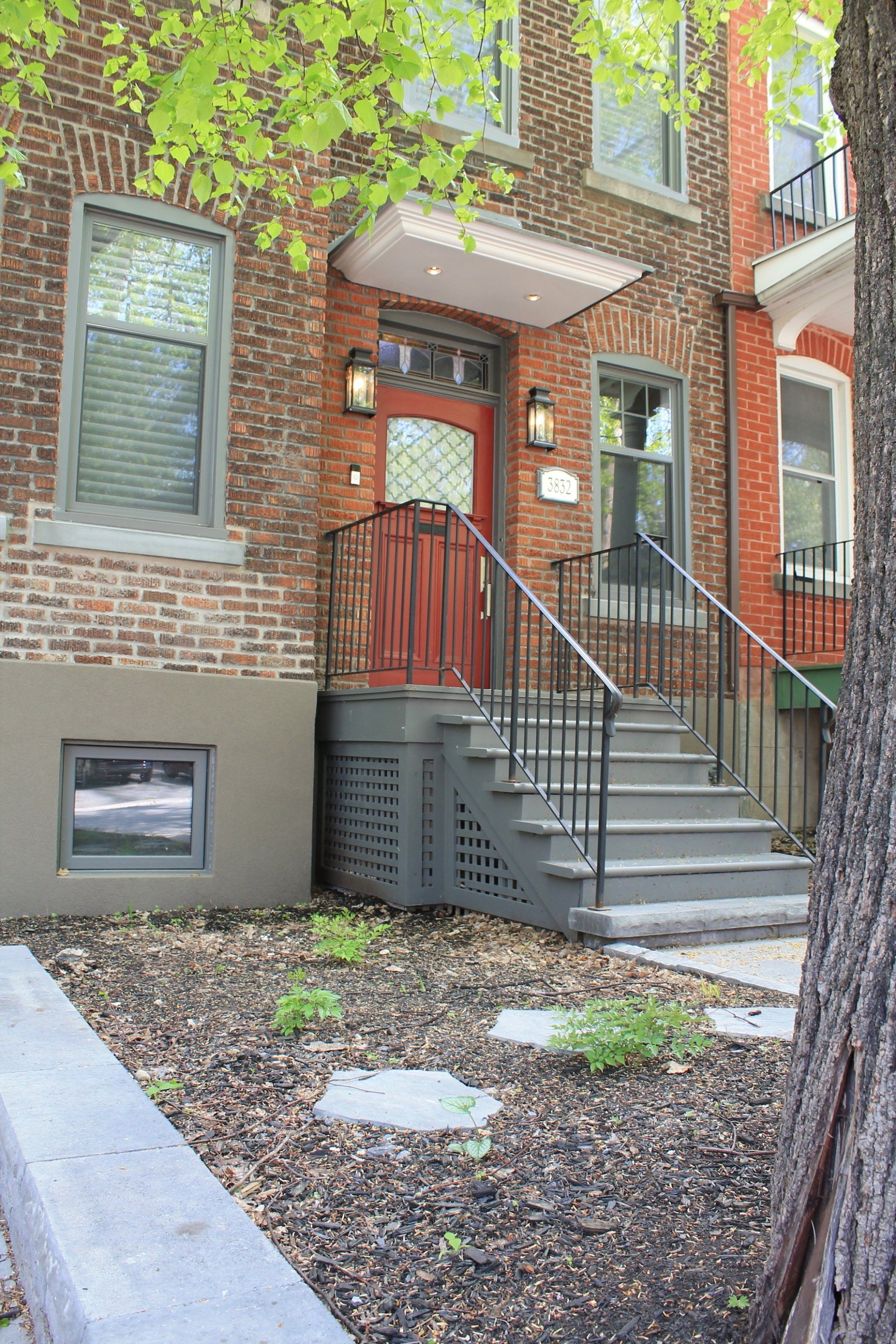 front view of apartment with dirt and walkway