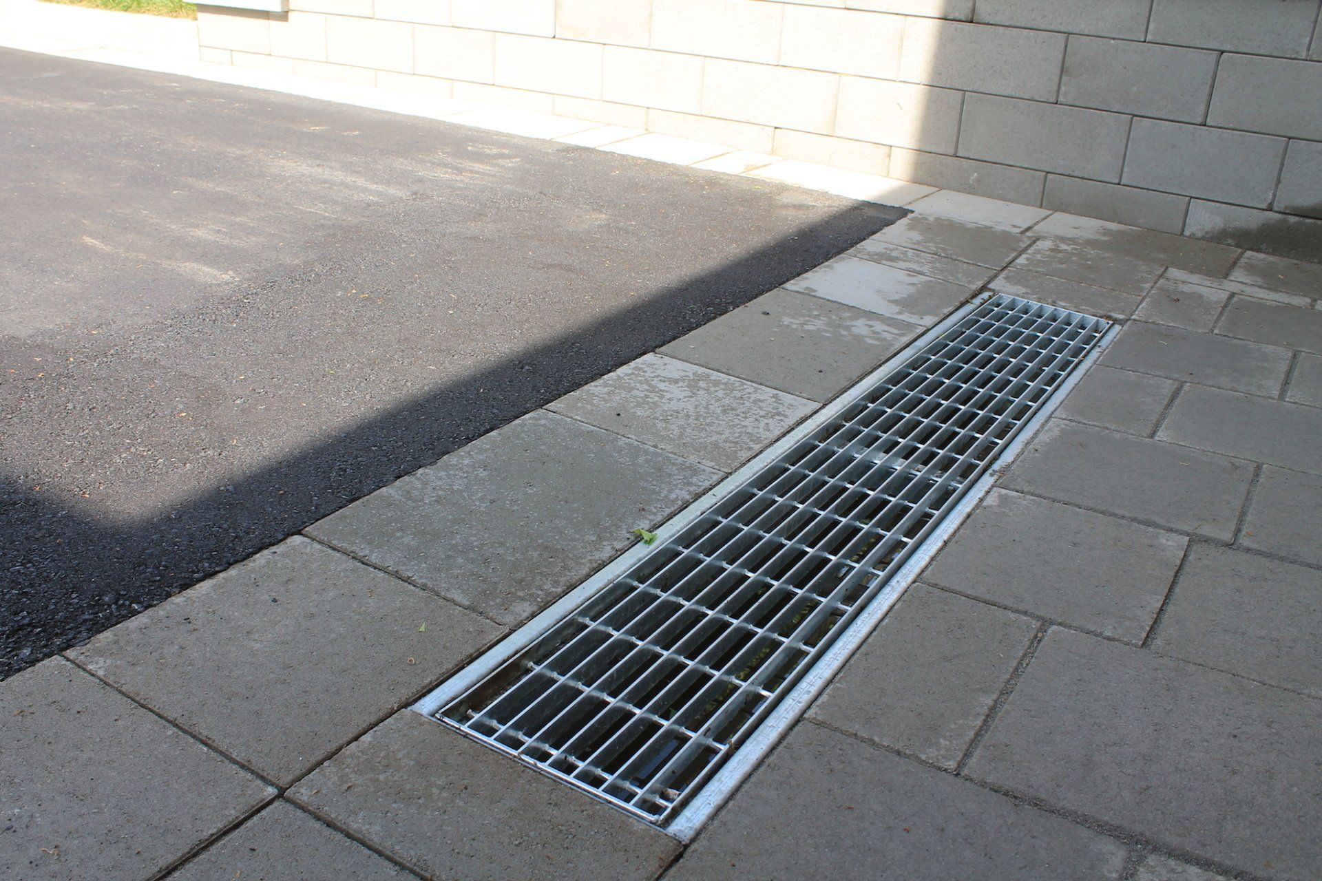 water drain surrounded by brick