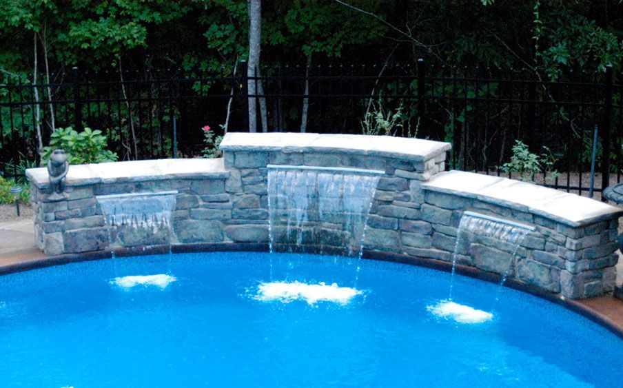 There is a waterfall in the middle of the pool