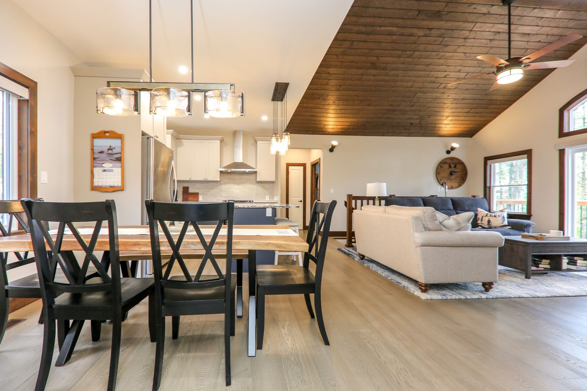 There is a table and chairs in the middle of the room.