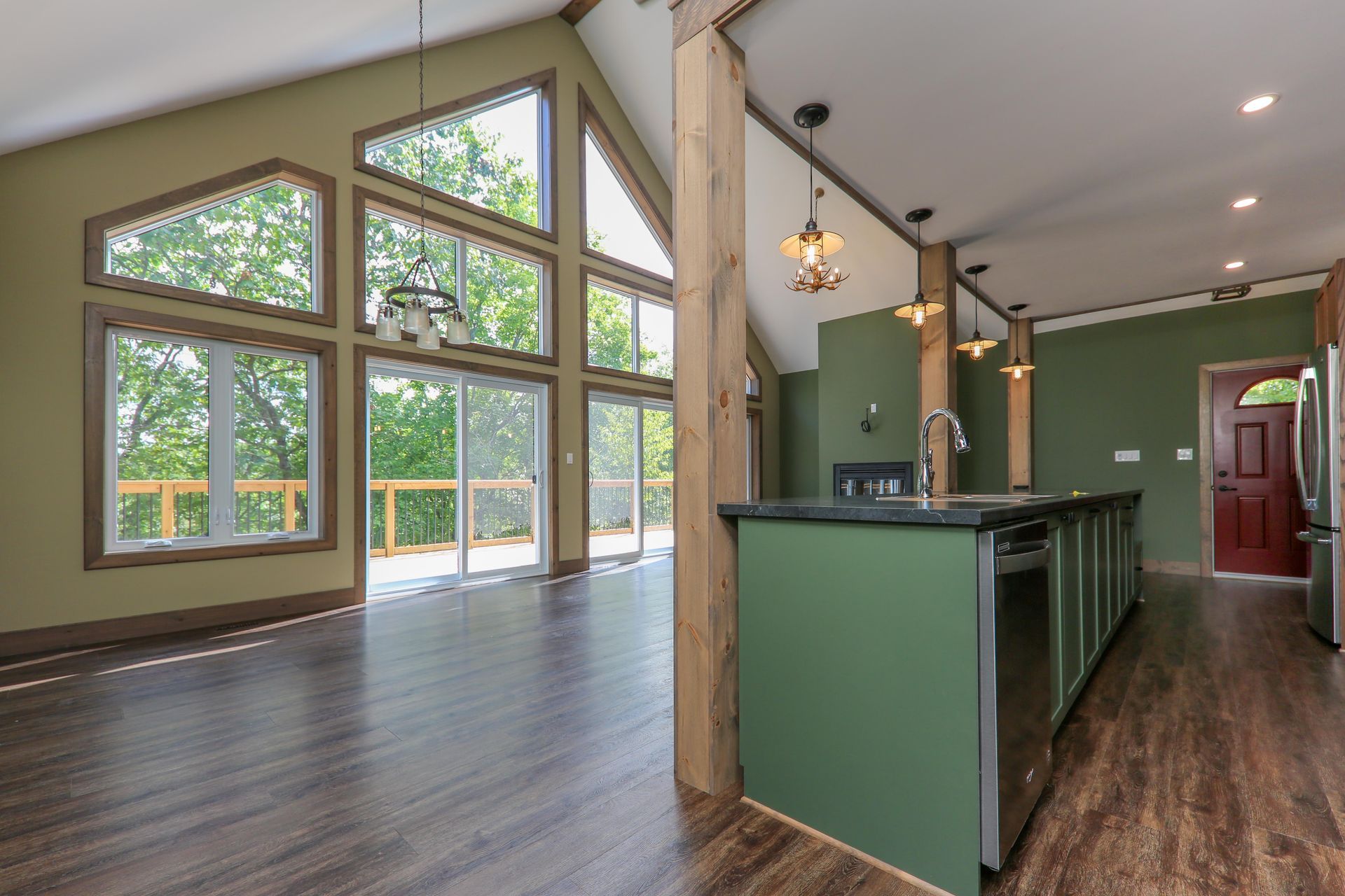 A kitchen with a large island and lots of windows
