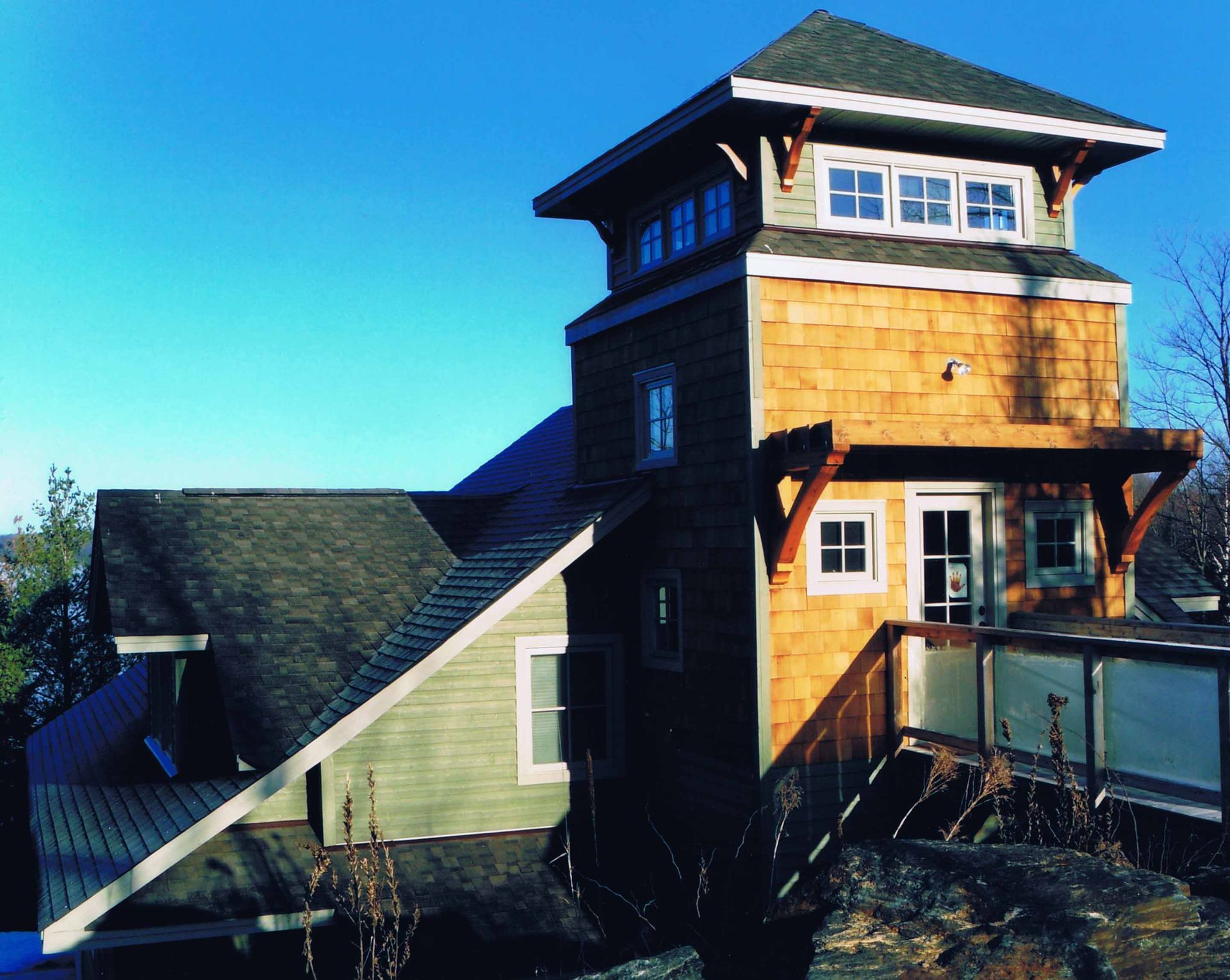 A house with a large tower on top of it