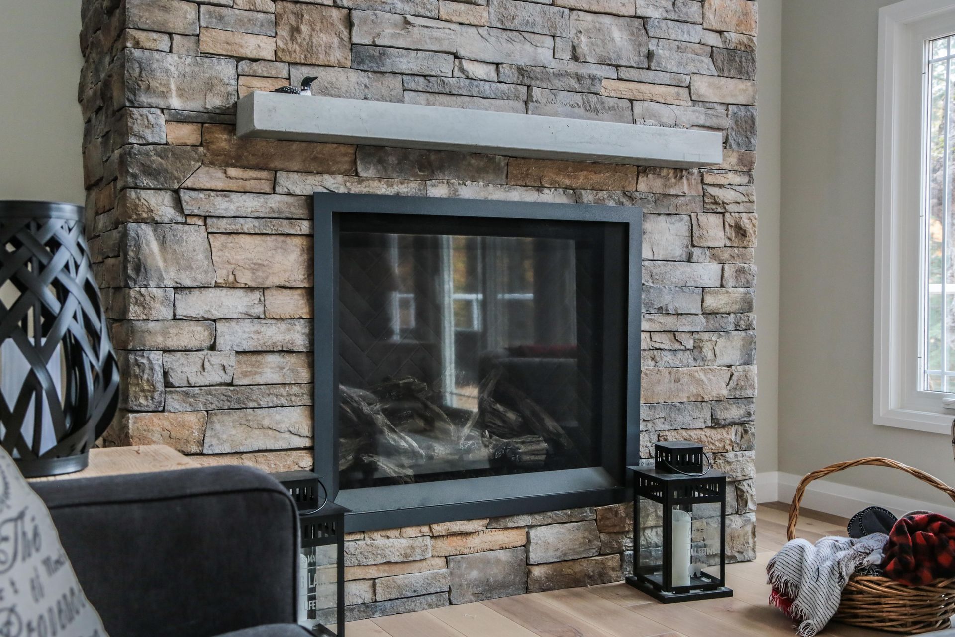 A living room with a fireplace and a couch.