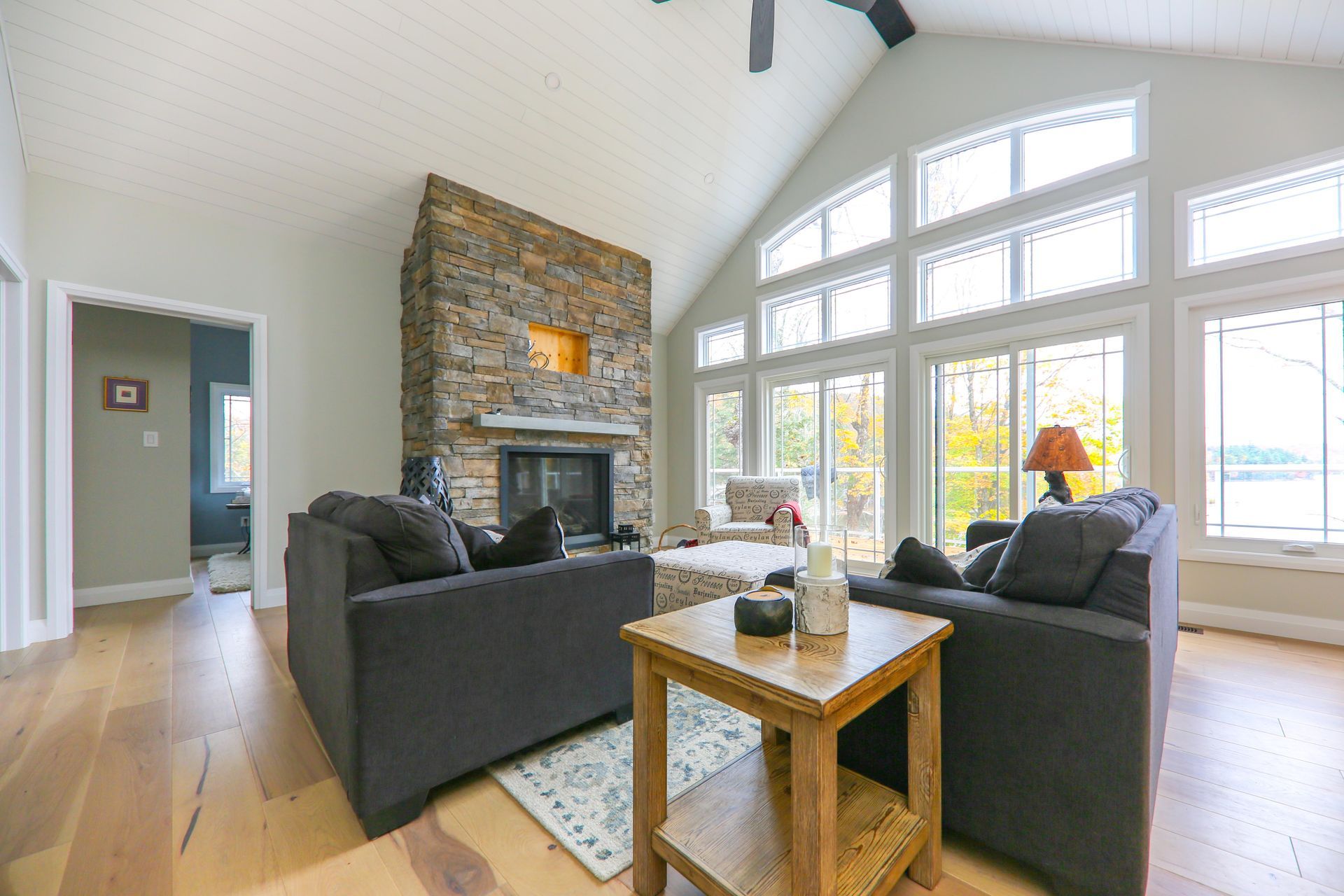 A living room filled with furniture and a fireplace.
