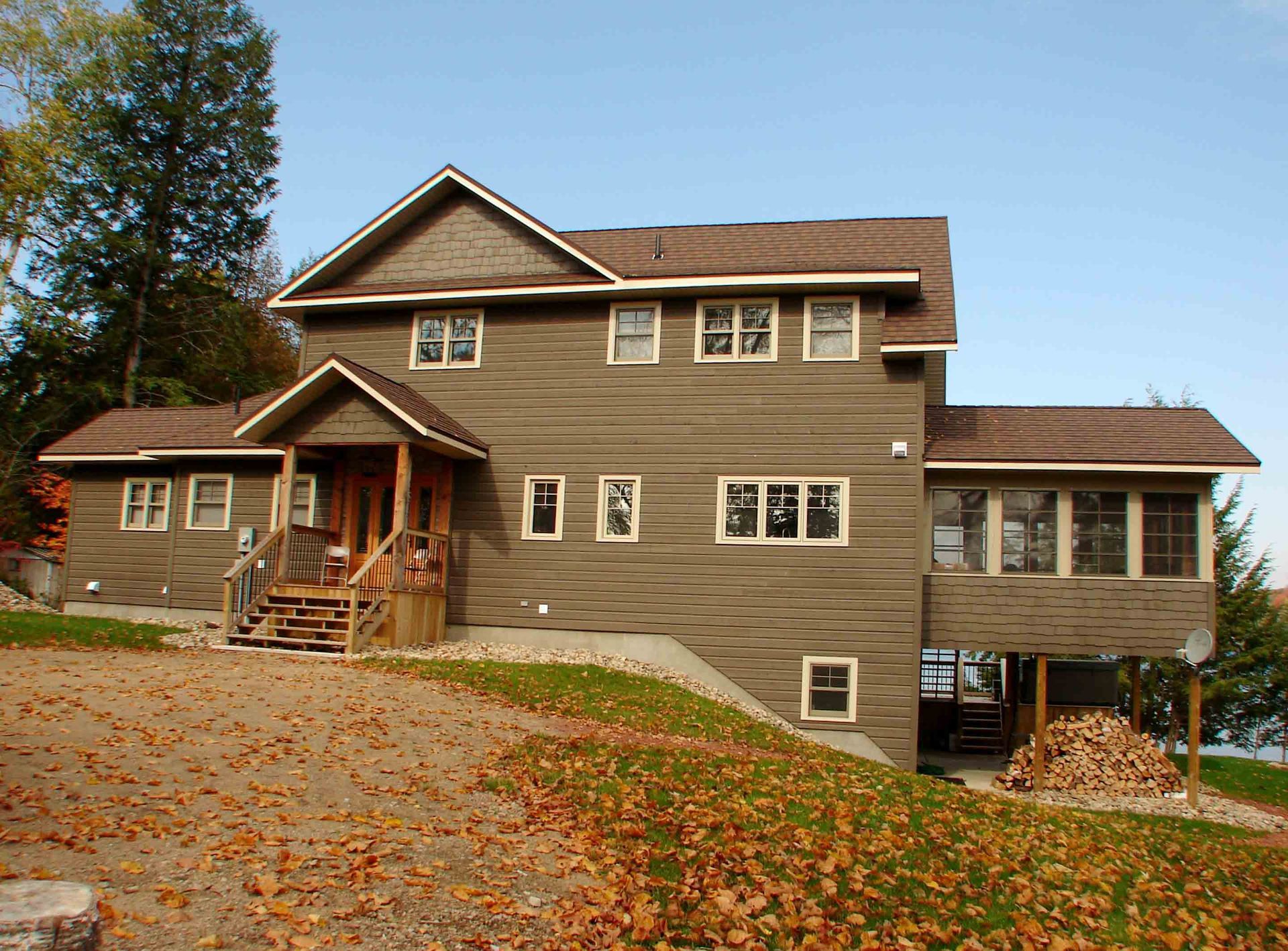 A large brown house with a lot of windows