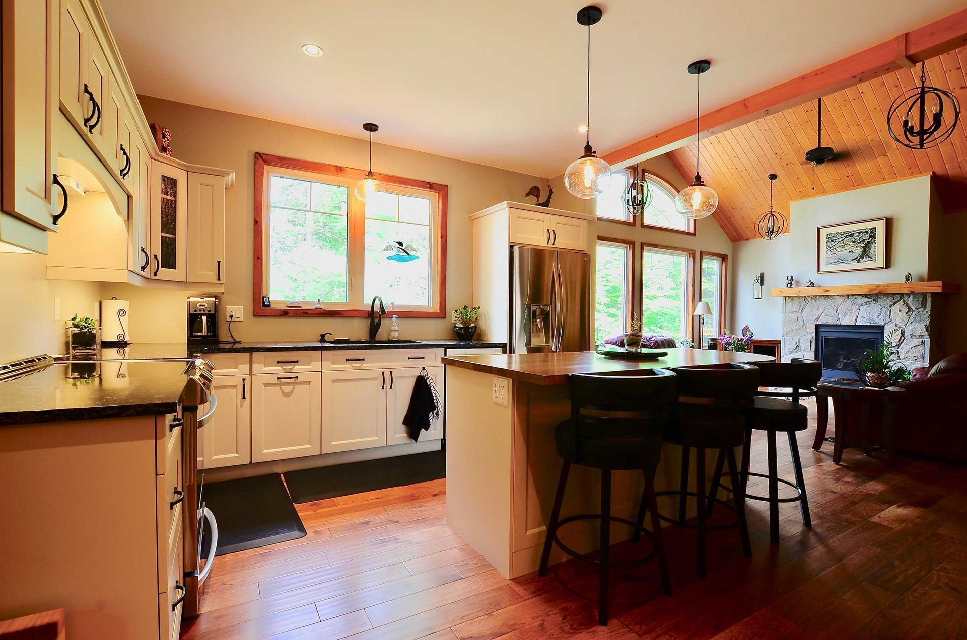 A kitchen with a large island and a fireplace